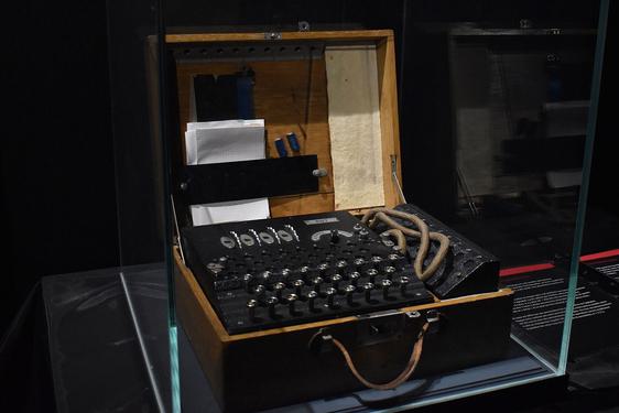 A cryptography machine in a glass case.