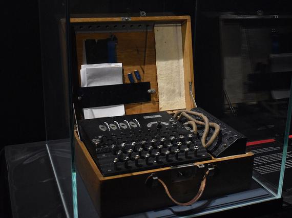 A cryptography machine in a glass case.