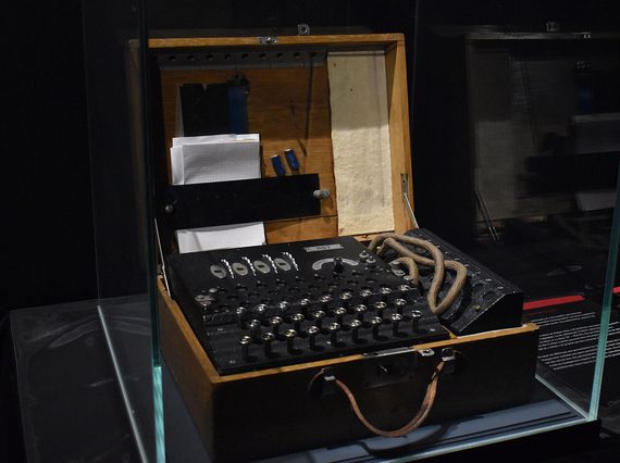 A cryptography machine in a glass case.