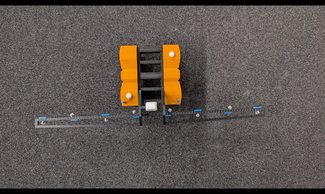 3D printed model of a yellow robot taken from above