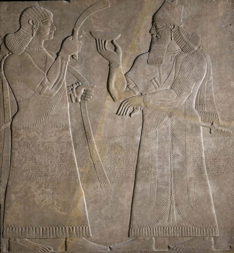 Stone panel depicting two human figures facing each other.