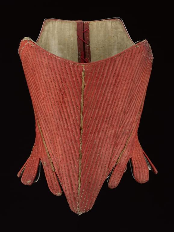Stays (corset) made from red ribbed lined.