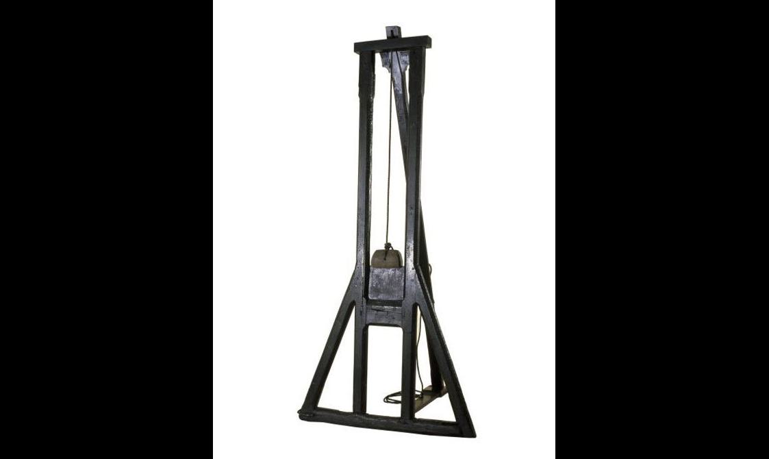 A wooden guillotine.