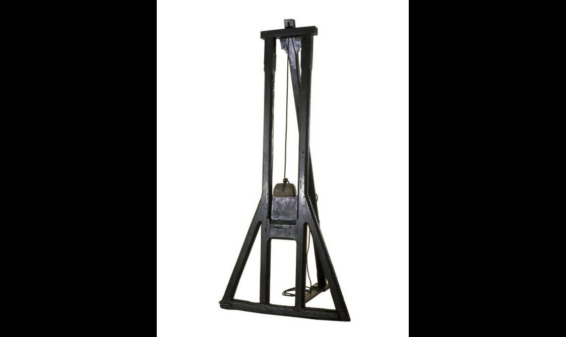 A wooden guillotine.