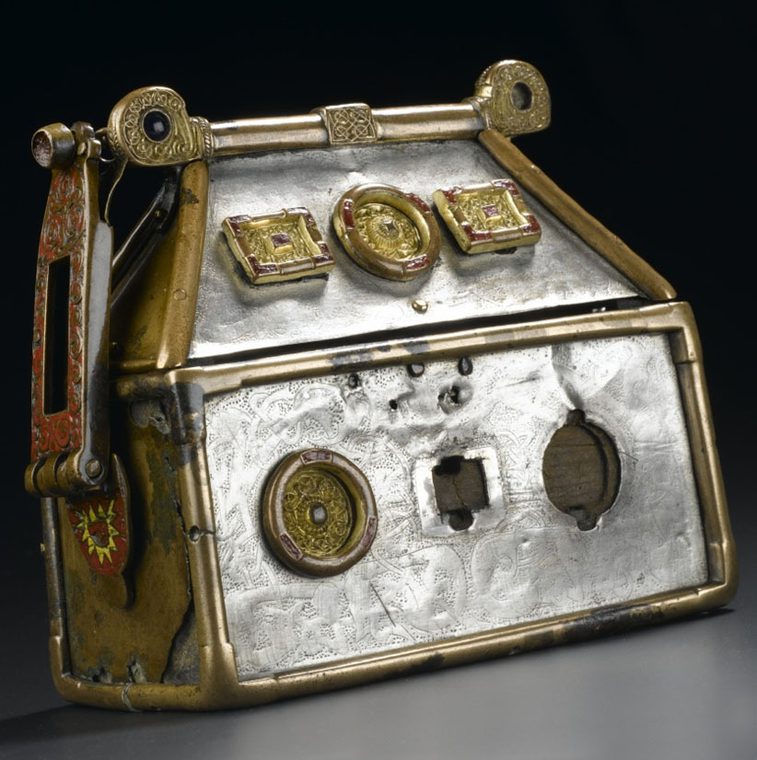 Rectangular casket with lid in the form of a roof. Made from wood, copper alloy, silver enamel and blue glass, decorated with intertwined animals.