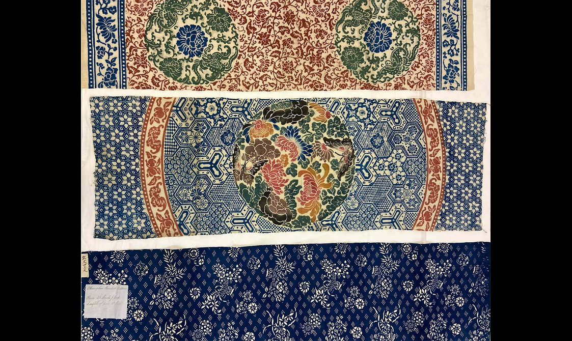 Three samples of colourful cotton cloths arranged horizontally. Each cloth has a different design common to cotton manufacturing in China.