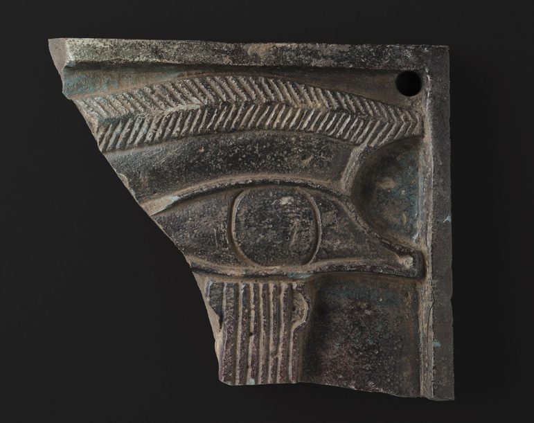 A plaque with a large Eye of Horus carved into it.