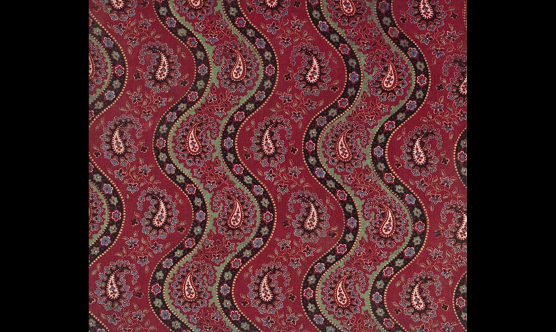 Vibrant red fabric separated into five section with black color background and floral motif waves. The golden leaf motifs set against red color background.