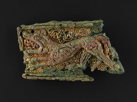 Rectangular gilt-bronze mount depicting a lion, reused as a brooch in the grave of a woman and infant from Westness, Rousay, Orkney, length 66mm,