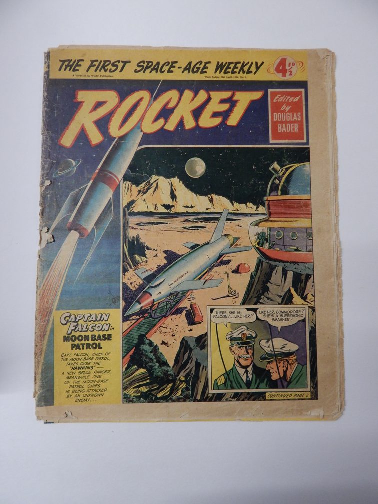 The cover of a paper comic, with space age illustrations and titles of a rocket blasting into space.
