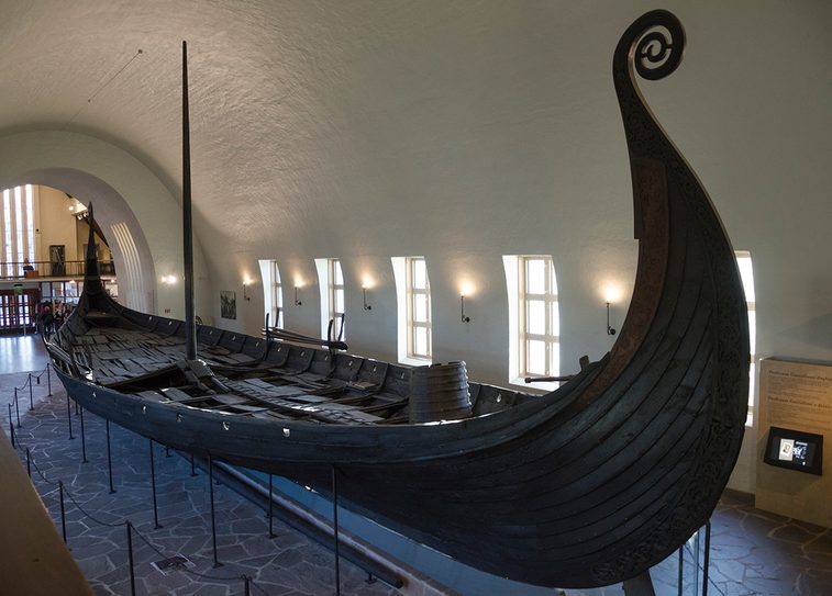 A Viking boat on display in a museum gallery
