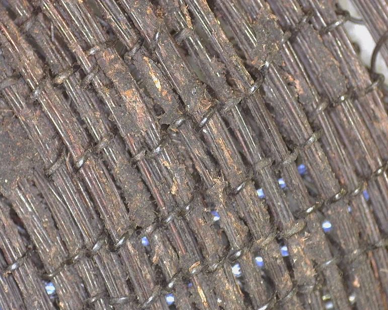 Close up detail of the horse-hair hat, showing the technique of wrapped twining.
