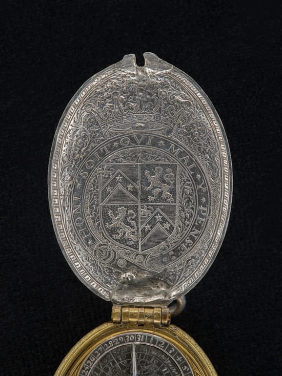 Close up of 17th century silver watchcase showing a new coat of arms, featuring the Kerr family arms augmented with the royal Stewart lion rampant.