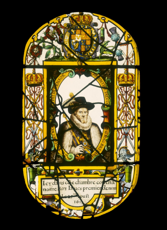 Oval glass panel of stained and painted glass with a rectangular panel in centre containing a half length portrait of James VI and I