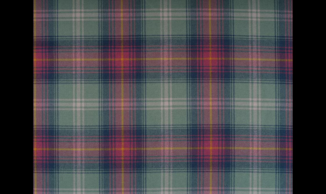 A tartan textile in pink, purple, and green check pattern