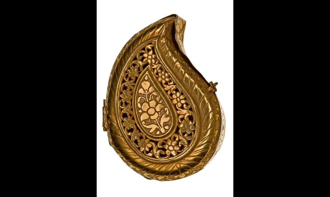 An ornate gold box in the shape of a tear drop