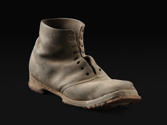 A square toed, lace up leather ankle boot.