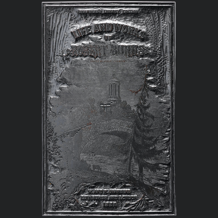 A wooden panel craved with a book cover of a title and a landscape scene. The panel is painted silver.