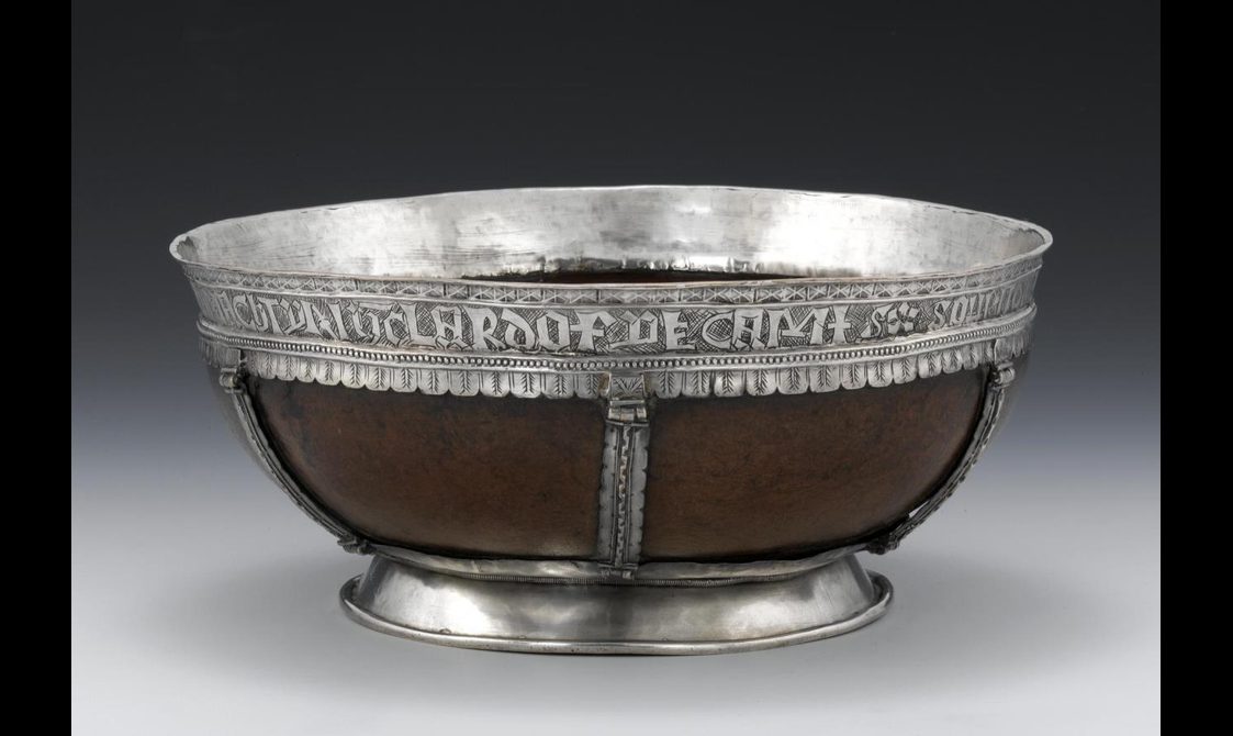 Circular wooden maple bowl with silver base and engraved silver rim.