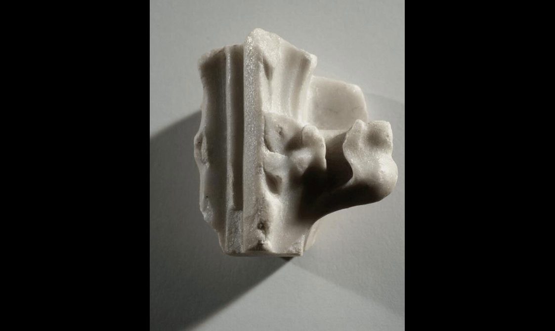 Alabaster fragment with some carving.