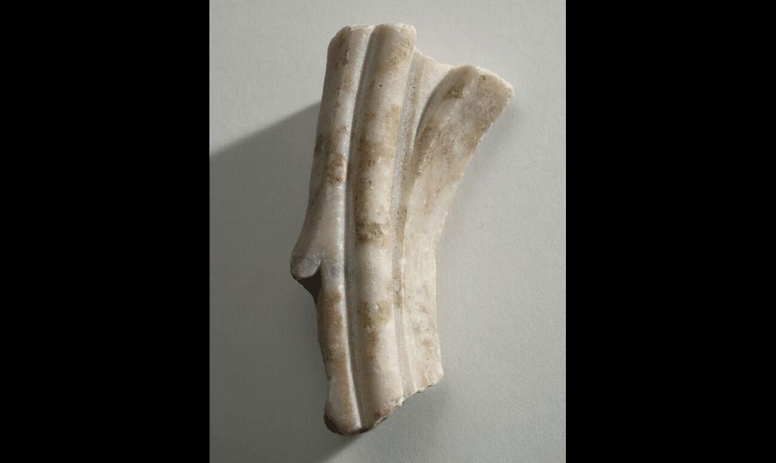 Alabaster fragment with some carving.