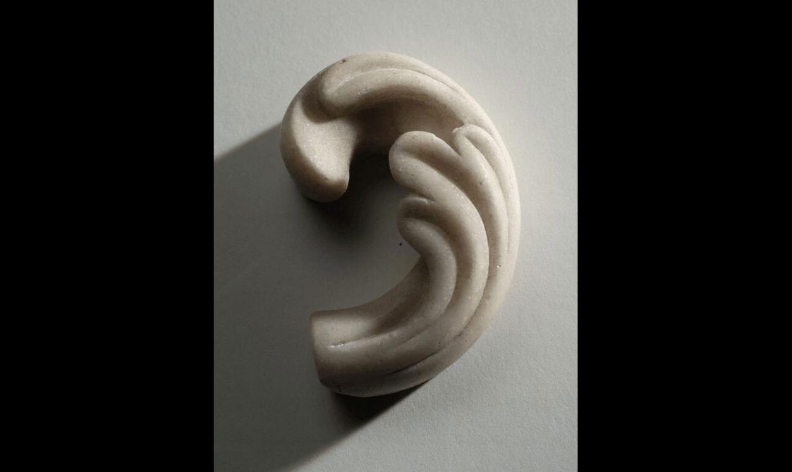 Alabaster fragment with some carving.