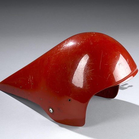 A red cycling helmet with a long pointed end