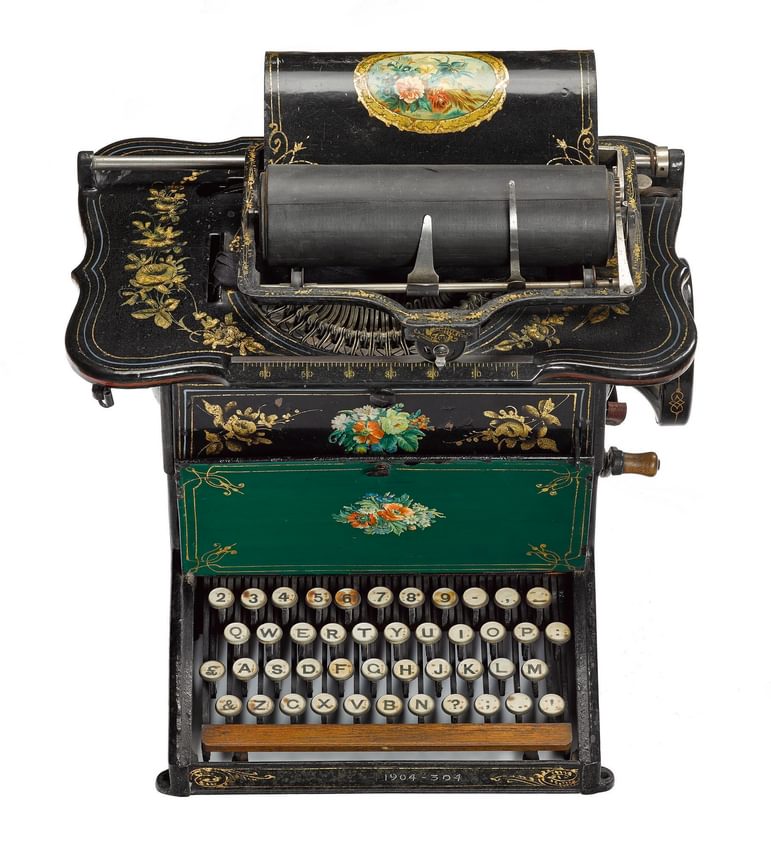 Black Sholes and Glidden typewriter with floral design from 1876.