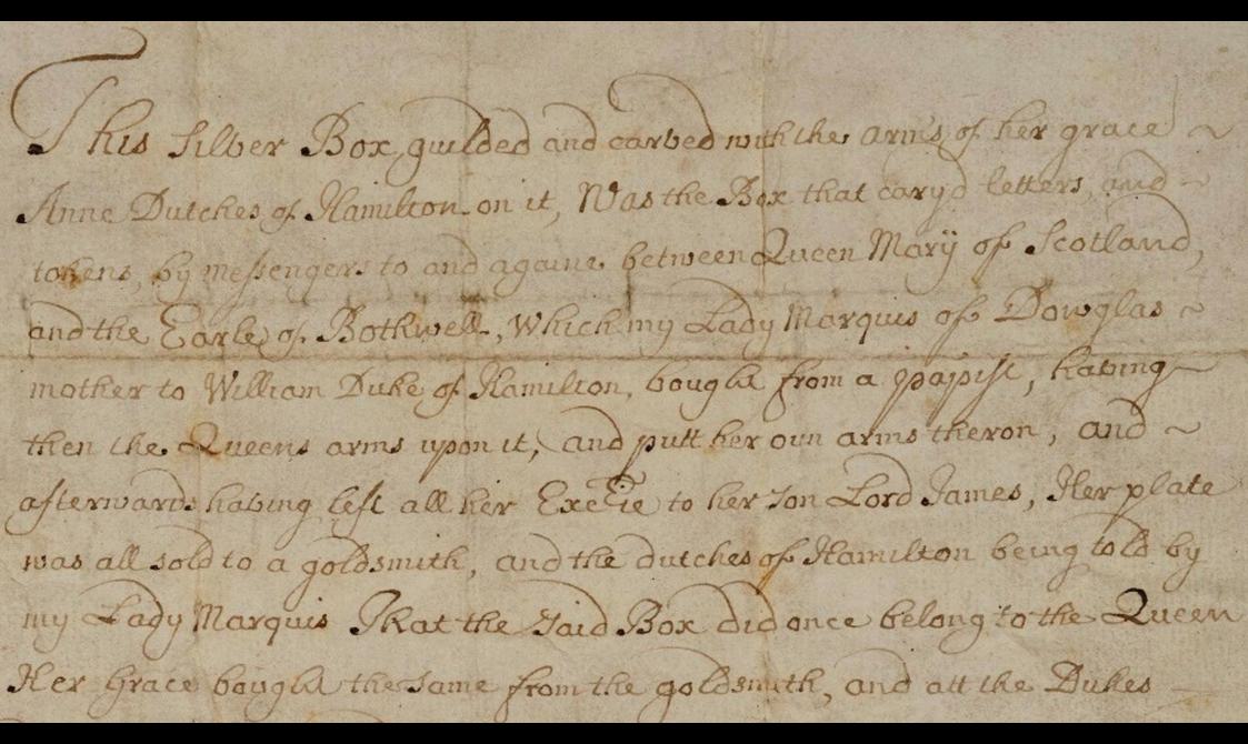 Closeup of faded black semi-cursive script on aged paper discussing the ownership of the silver casket.