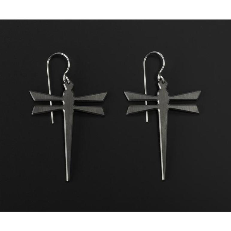 A pair of silver earrings in the shape of dragonflies