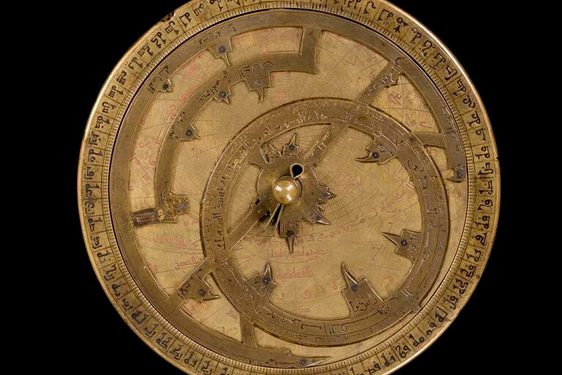 Bronze clock-looking model with ornate dials and decoration to represent the motions of the Sun and stars.