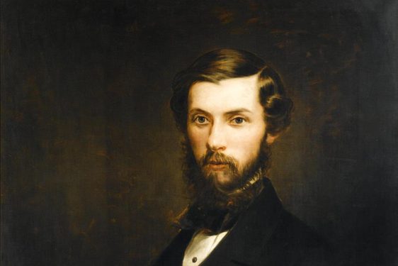 A painting of a man looking outward with short brown hair and a beard wearing a white shirt and black jacket
