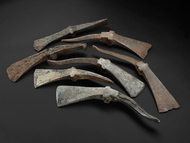 Seven pick-axe heads, each with a nasty looking spike on the back. Not much variation in size, though some are more badly rusted than others.