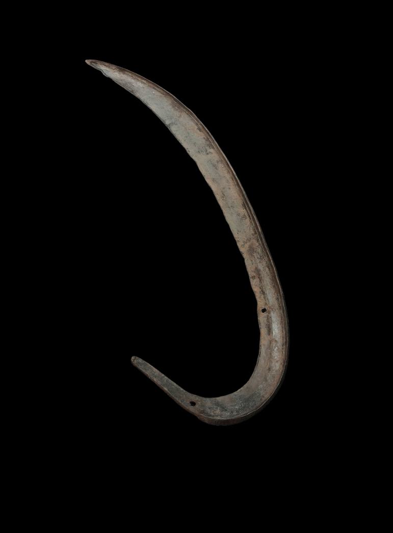 Metal hook with two punch holes oriented to resemble a very large fish hook.