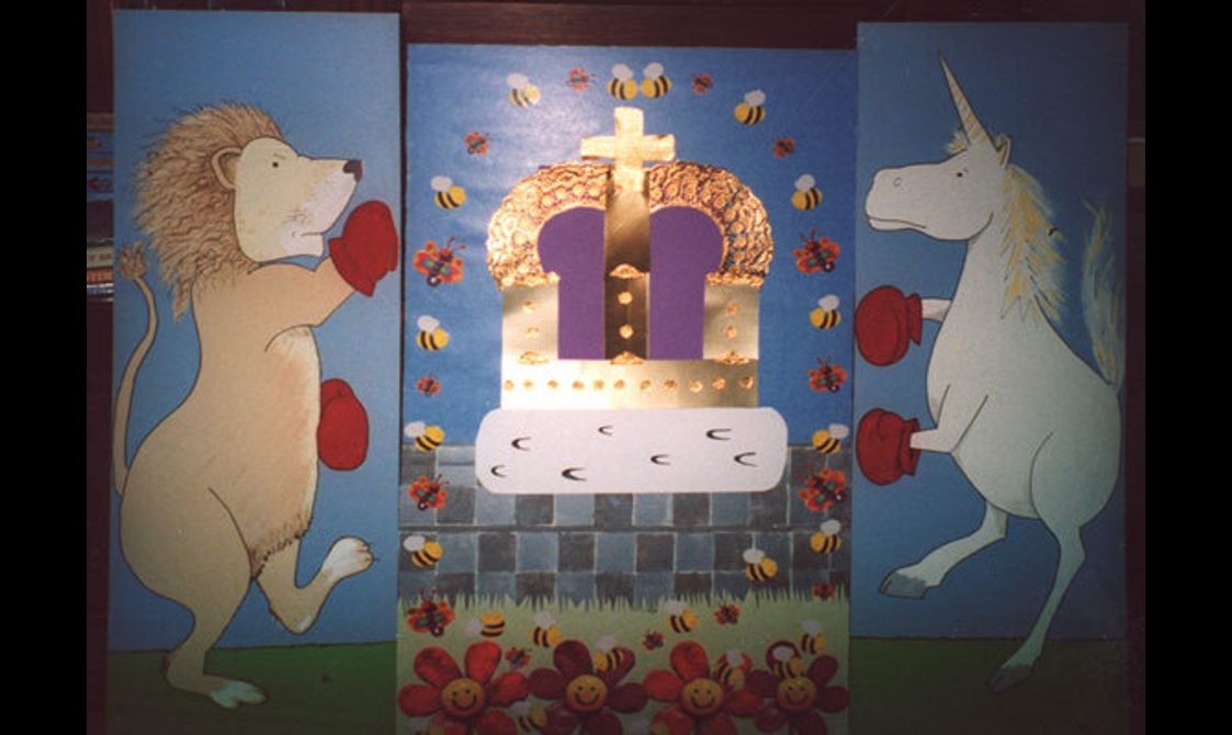 Three painted panels depicting a lion and unicorn wearing boxing gloves and a golden crown.