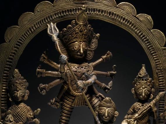 Cast brass figure of the Hindu goddess Durga as Mahishasura slaying the buffalo demon Mahisha.