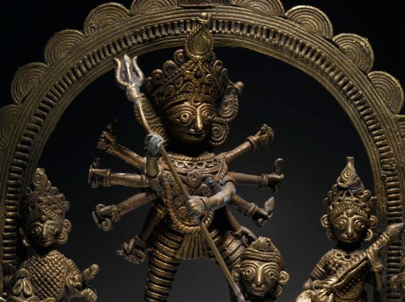 Cast brass figure of the Hindu goddess Durga as Mahishasura slaying the buffalo demon Mahisha.