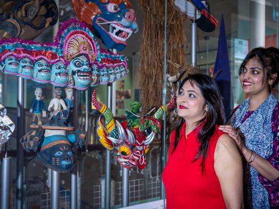 Members of NKS admire the craftmanship of the mask of Ravana.