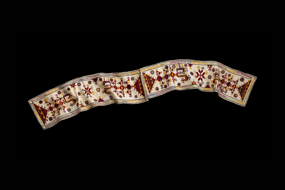 Abstract patterned scarf with sewn in mirrors in oranges, reds and yellows.
