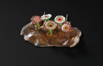 A colourful glass sculpture of sea creatures that resemble flowers