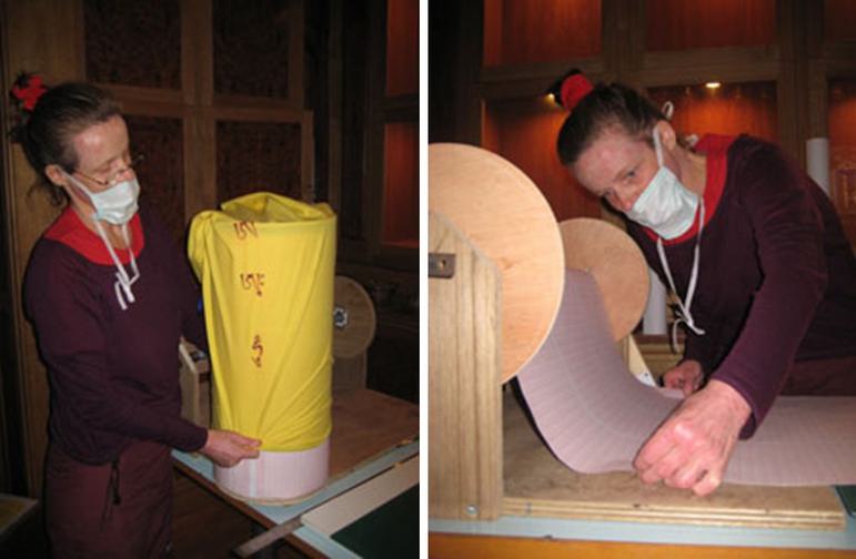 Two images side by side. One image shows a woman wearing a mask pulling a yellow cover over a roll of paper, the second image shows the woman pulling from a paper roll mounted on a wooden spool.