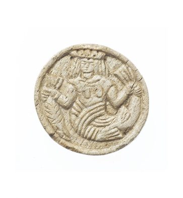 A beige stone disc with a stylised mermaid wearing a crowd etched into the surface