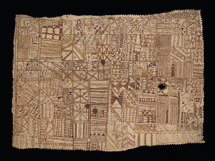 Tan coloured hiapo (barkcloth) painted with geometric and naturalistic designs and text with serrated edges.