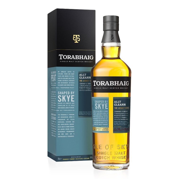 Whisky bottle with a teal label beside its teal and black box against a white background.