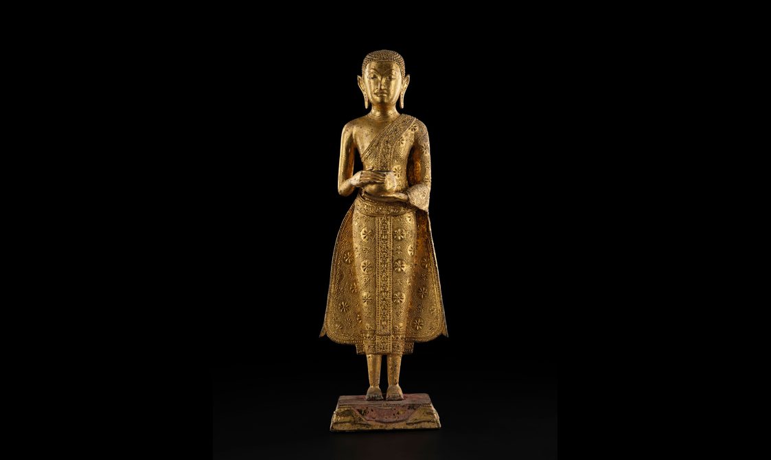 A Buddha sculpture holding an alms bowl.