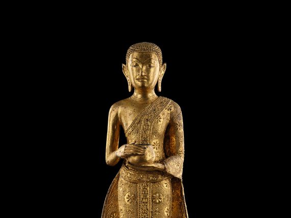 A Buddha sculpture holding an alms bowl.