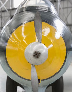 A front view of a Messerschmitt Me 163B-1a Komet. The front propeller is small and the nose is yellow.