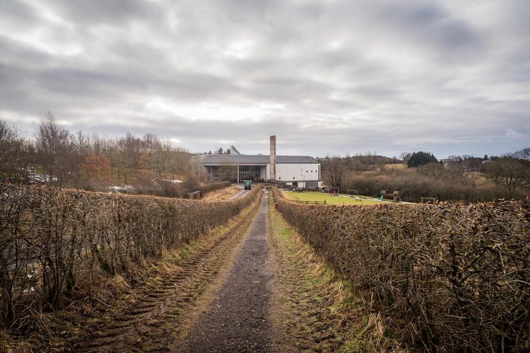 A footpath lined by hedges leading to the museum building of the National Museum of Rural life.