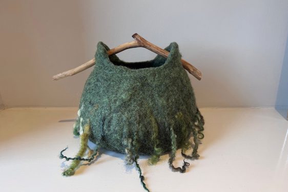 A basket made of green felt