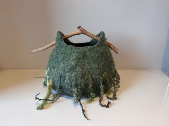 A basket made of green felt